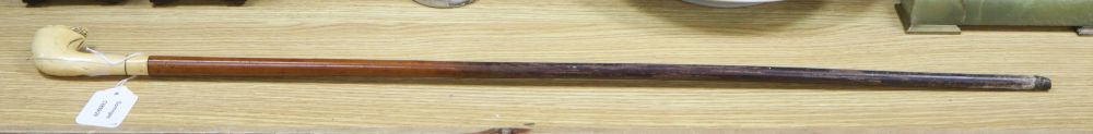 A Druids head carved cane, c.1860, length 85cm